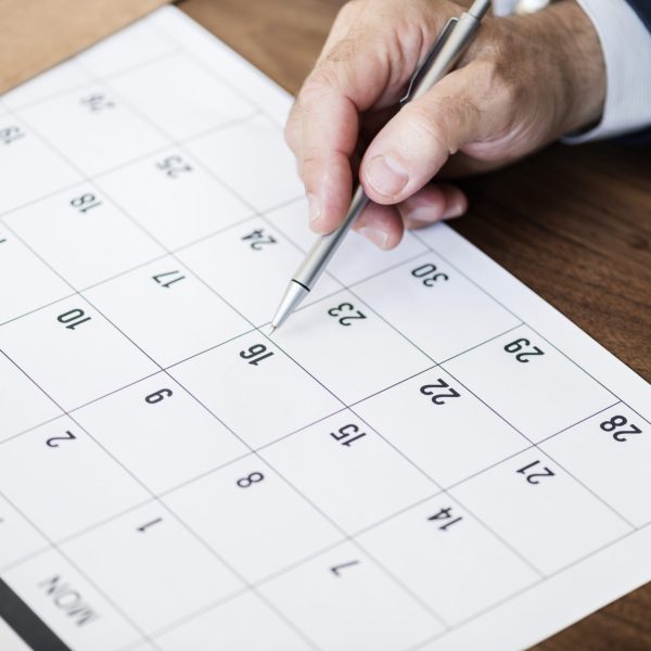 Businessman marking on calendar for an appointment